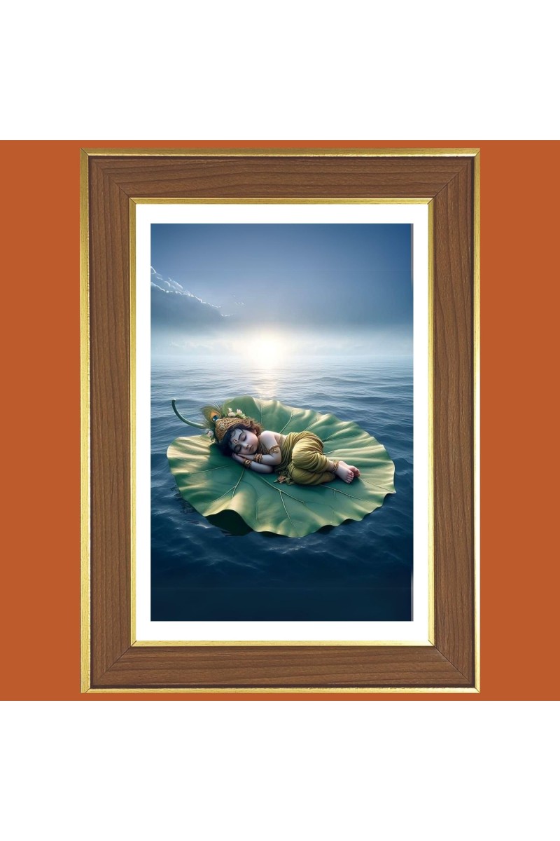 Baby Krishna Sleeping on a Leaf Photo Frame - 10x14 Inches, Brown Wooden Frame for Home, Office & Temple Decoration